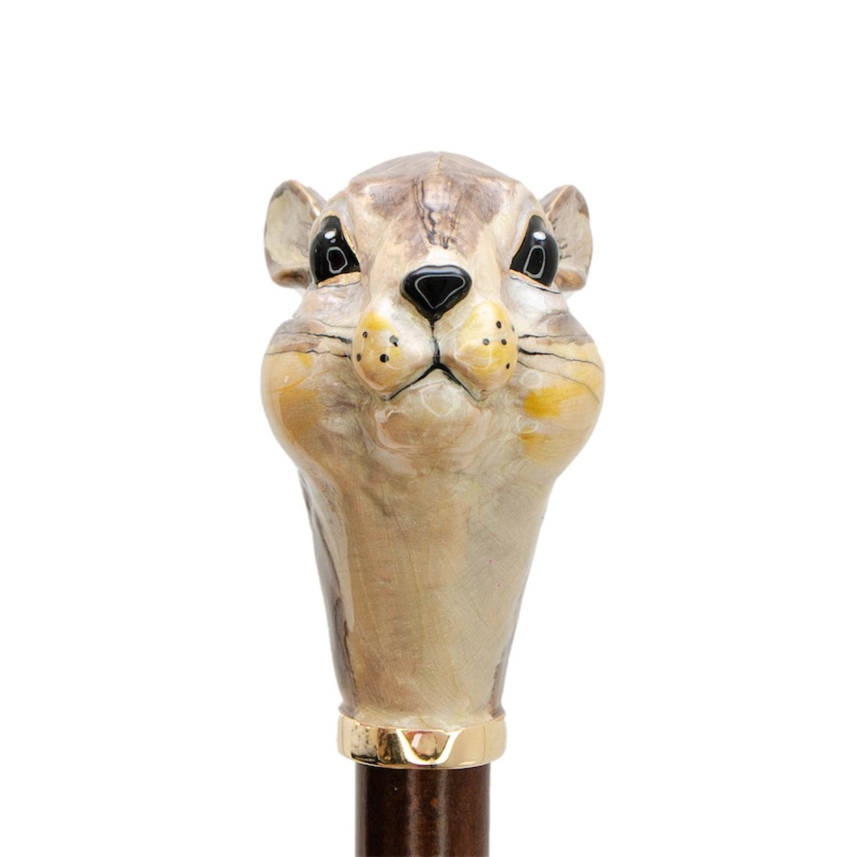 Enameled squirrel head from the front: black eyes, yellow cheeks and painted whiskers