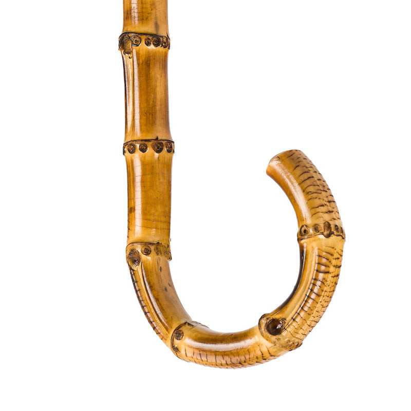Bamboo crook handle with natural nodes, close-up, handcrafted in Italy