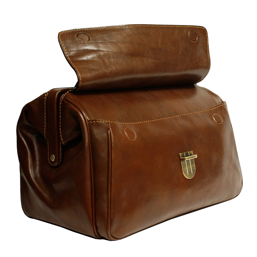 Front flap of the cognac Italico 8051 lifted — horizontal pocket with a tuck lock underneath