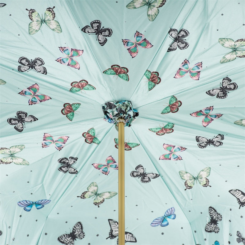 Inside of the canopy: pink, green and black-and-white butterflies on a mint ground