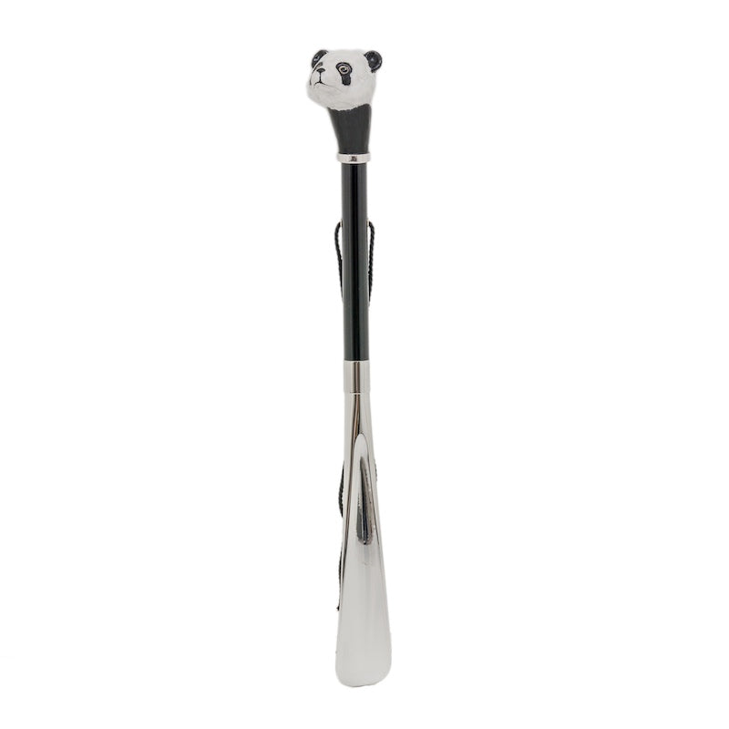 Panda shoehorn standing upright: glossy black shaft, hanging cord and silver-tone blade