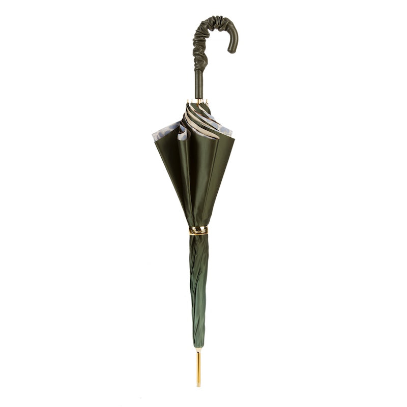 Closed olive green umbrella standing upright with the ruched leather handle and gold-tone ring