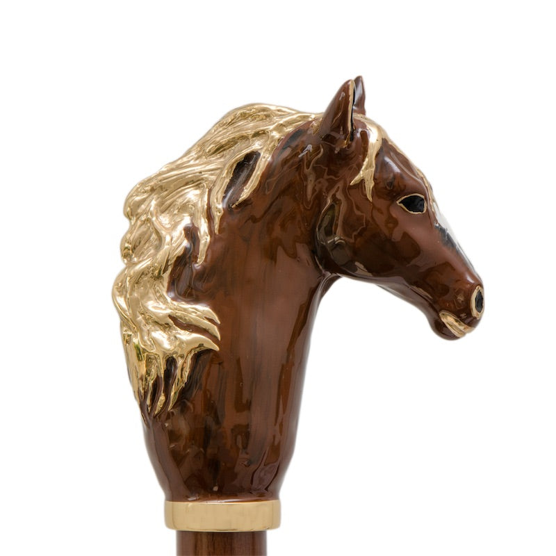 Brown enameled horse head with a flowing gold-tone mane, in profile