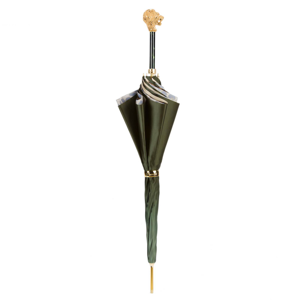 Closed olive green umbrella standing upright with the lion handle