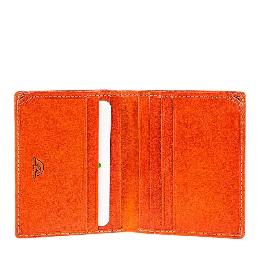 Tony Perotti Topkapi 1034 Mandarino — opened out: a slip pocket with the embossed Topkapi mark on one half, a stack of card slots on the other