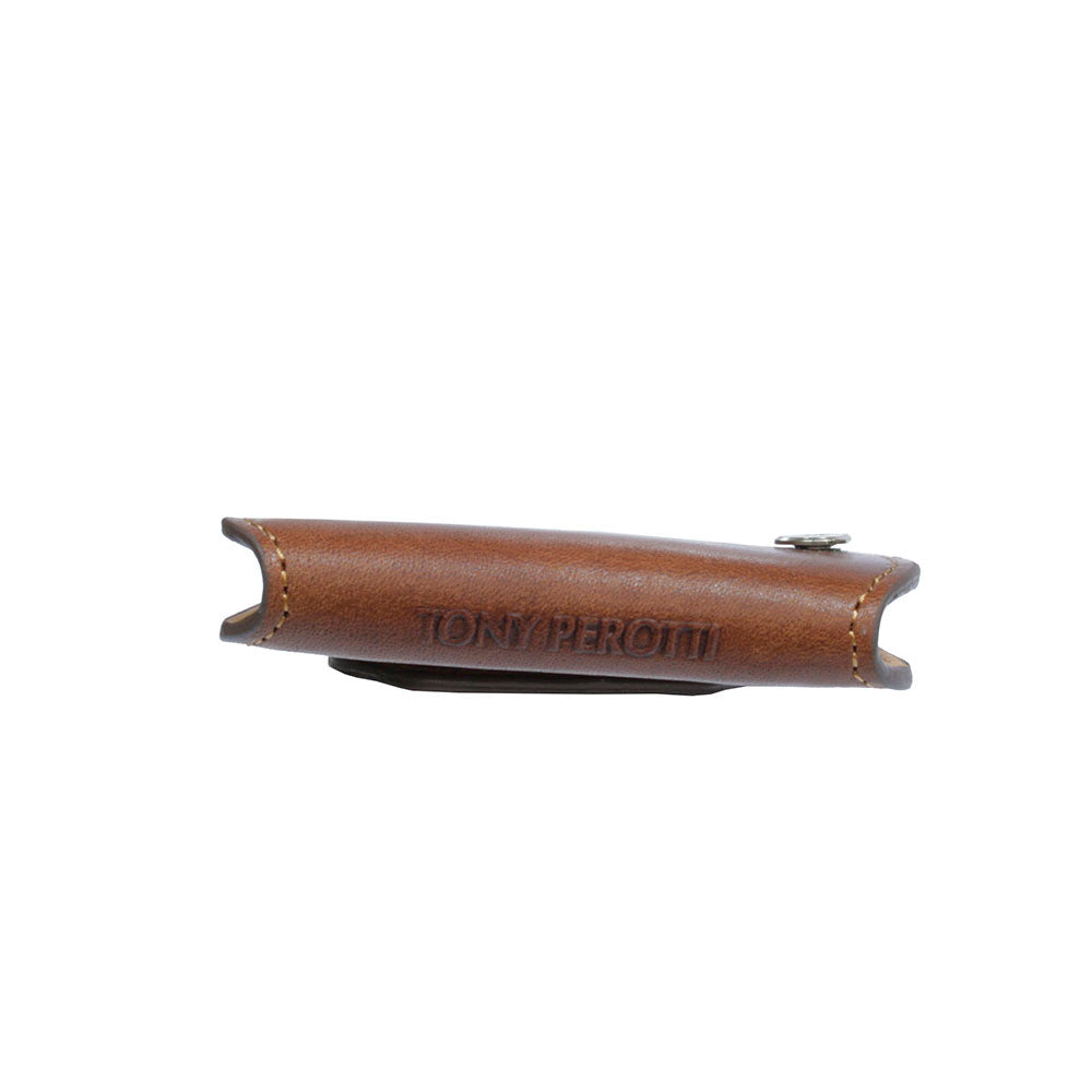 Tony Perotti Nevada KR-199 cognac — seen edge-on, showing how flat it folds and the «TONY PEROTTI» embossing