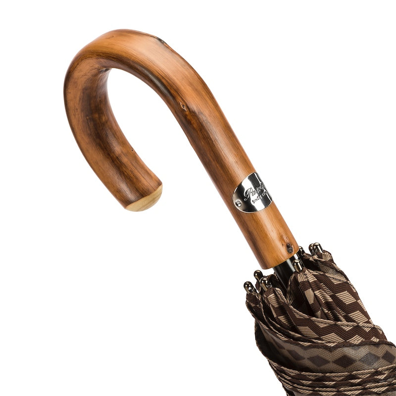 Chestnut crook handle with natural grain and silver-tone Pasotti plaque, close-up, handcrafted in Italy