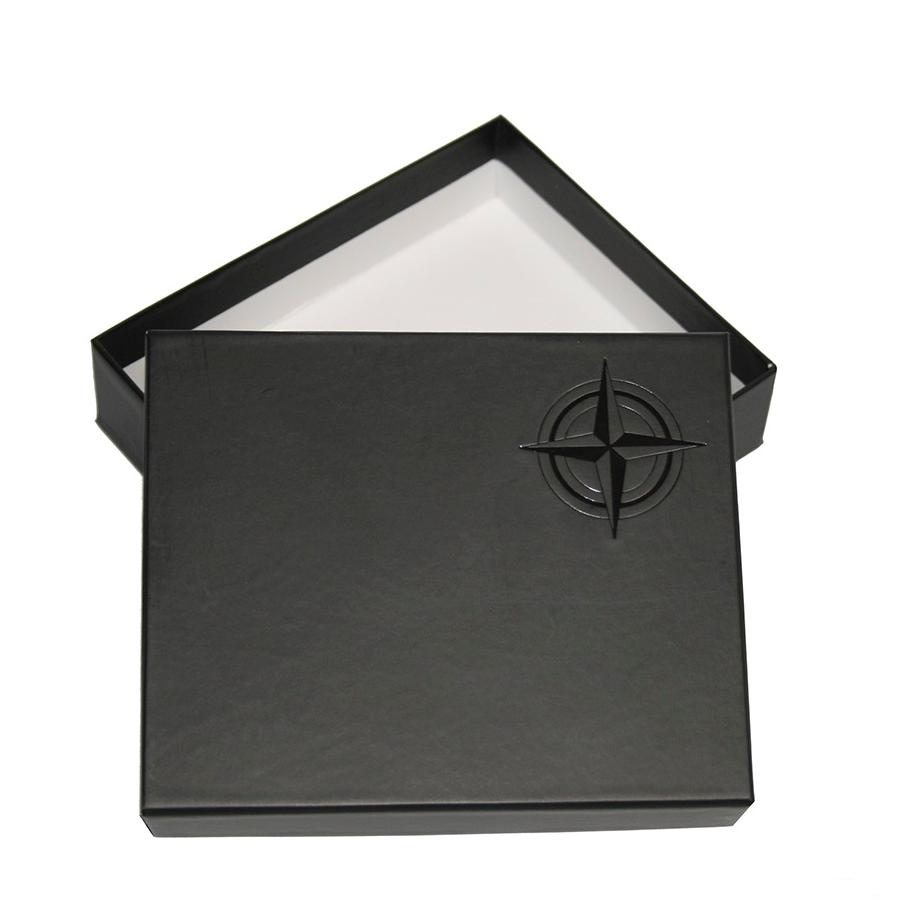 Black Tony Perotti Cortina box with a star emblem on a white background