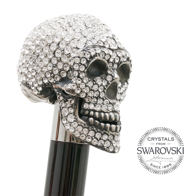 Crystal skull in three-quarter view on a silver-tone collar above the glossy black shaft, handcrafted in Italy