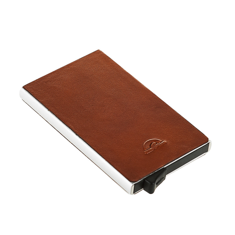 Tony Perotti Nevada 3771 honey — lying at an angle, showing the brushed aluminium body and the thumb lever