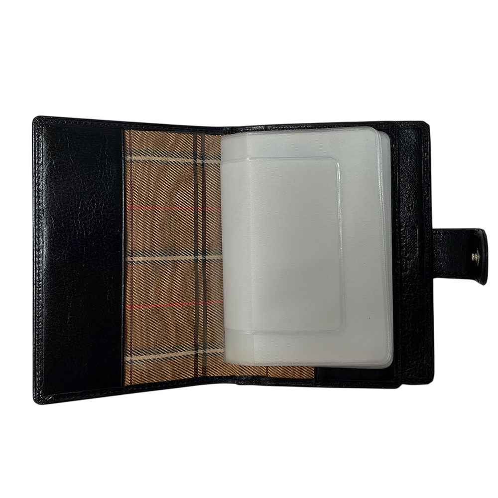 Tony Perotti Italico 1424A nero document holder opened — booklet of frosted clear sleeves over the right panel and the silver-tone snap on the tab