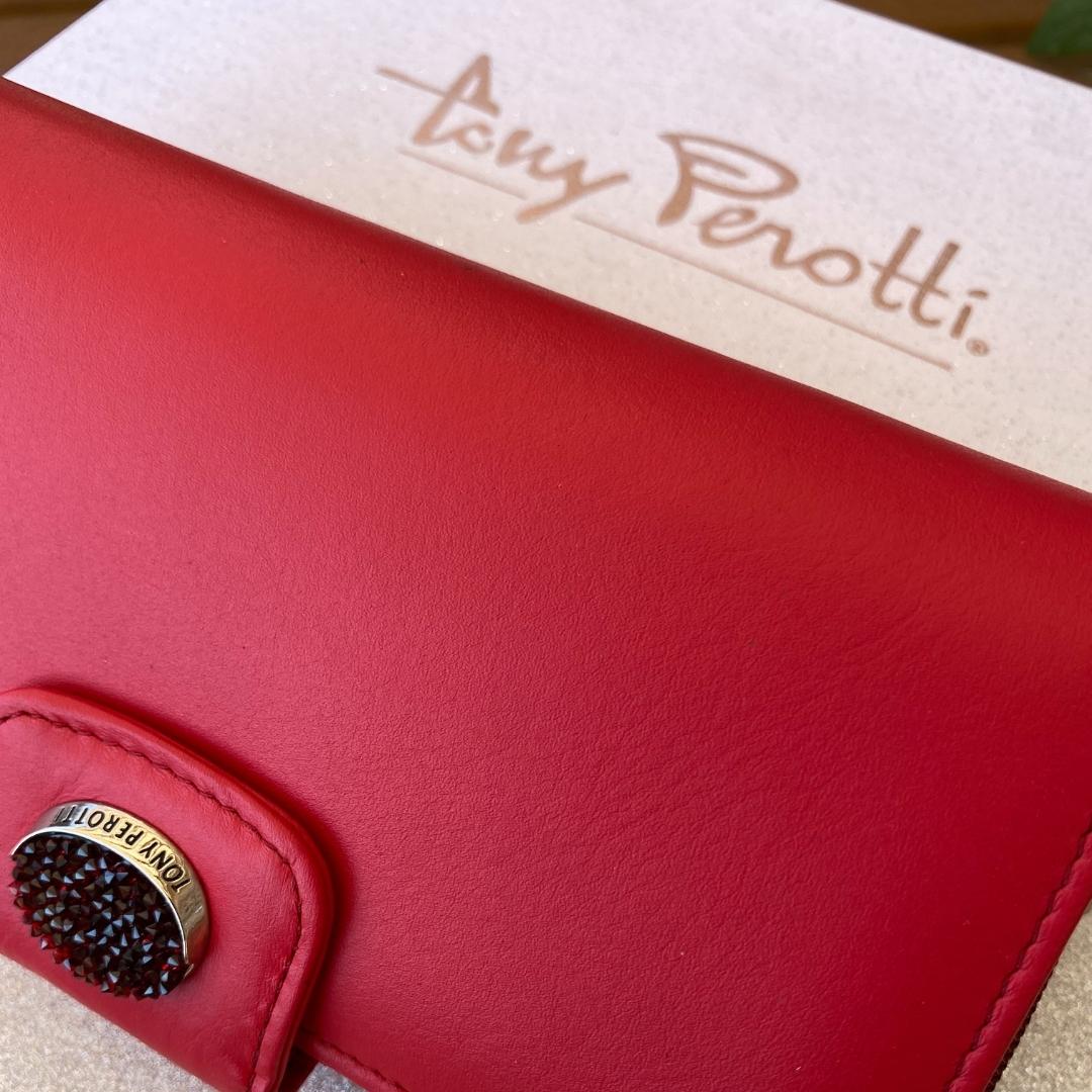 Red Tony Perotti Swarovski wallet on the branded box — crystal medallion detail