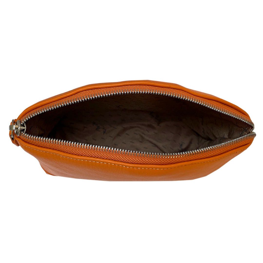 Open Tony Perotti orange leather cosmetic bag showing branded textile lining