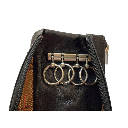 Black leather key case close-up of four key rings on holder bar inside open compartment — Tony Perotti Italico 2686 nero