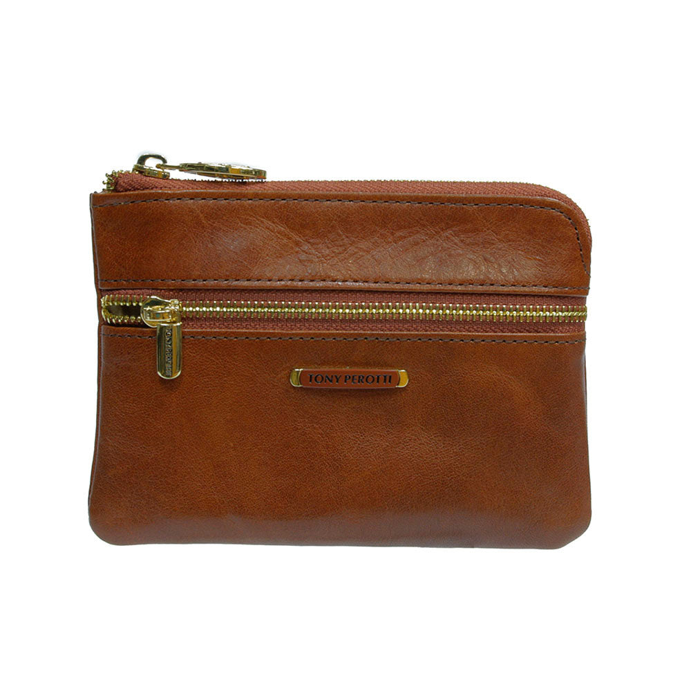 Tony Perotti Topkapi 3461 ambra — the amber-brown leather card holder closed, gold zips along the top and across the front
