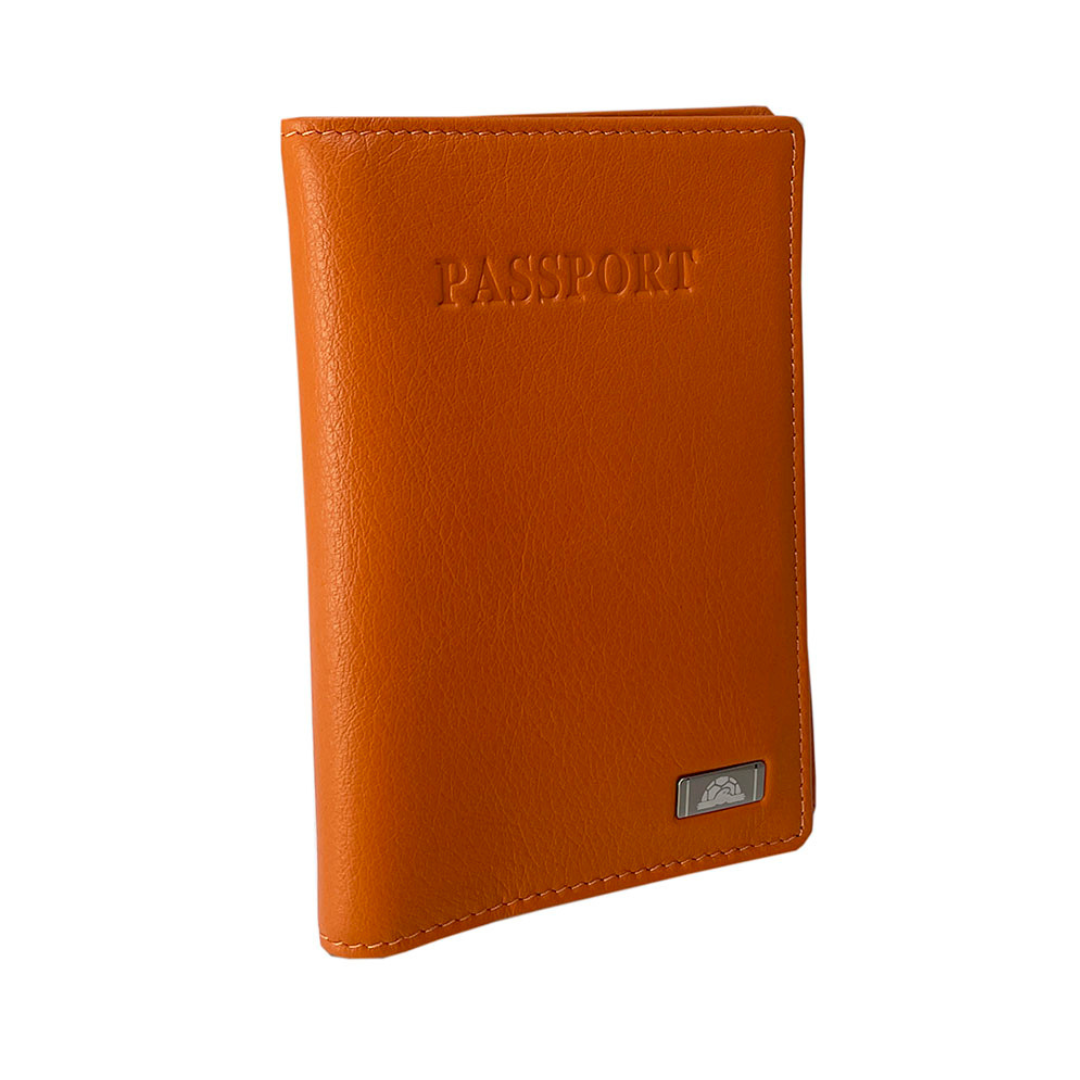 Angled view of the orange Tony Perotti Contatto 2241 arancio passport cover showing the fine pebbled grain and the silver-tone logo plate