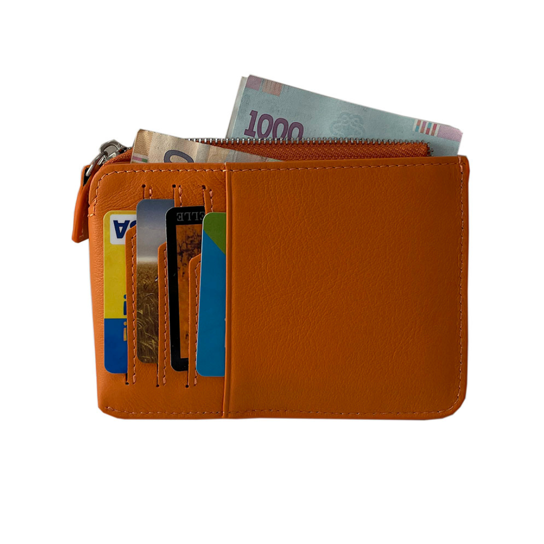Tony Perotti Contatto orange card holder open with cards and folded banknote