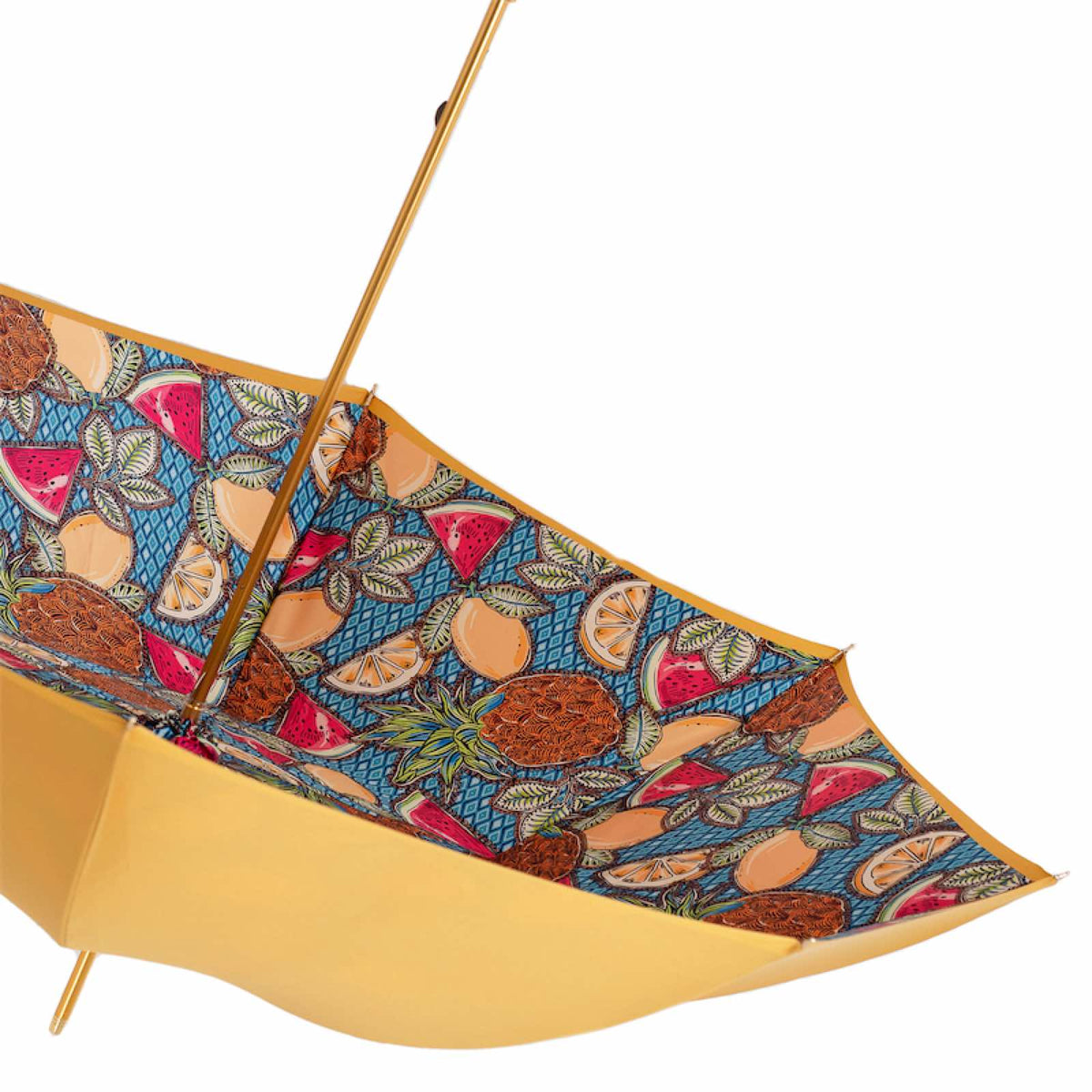Underside of the open canopy with the fruit print and gold-tone shaft