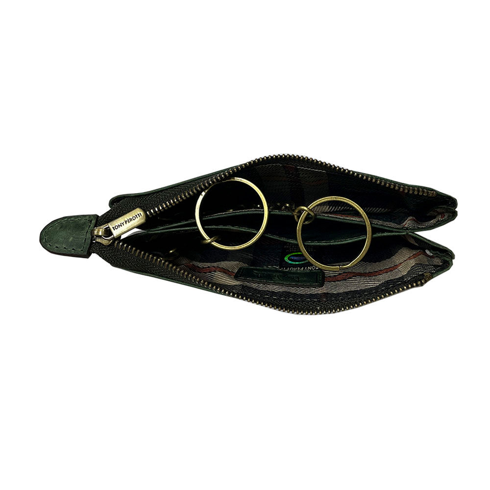 Green Arno 3350 key case open — two zip compartments with tartan-check lining, the brass key rings and the Tony Perotti security hologram