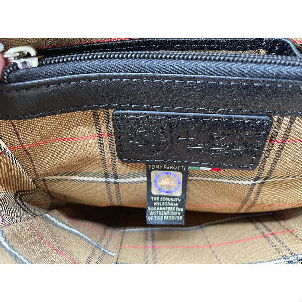 Close-up of the leather Tony Perotti logo patch and hologram tag of authenticity on the checked lining of the Italico 9137-20