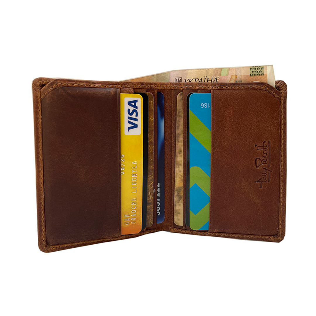 Tony Perotti Arno 1034N whisky — open and filled: cards in the slots on both halves and banknotes folded between them