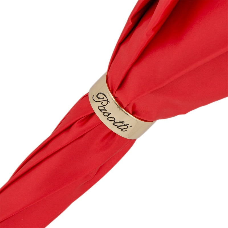 Gold-tone ring engraved Pasotti on the furled red canopy