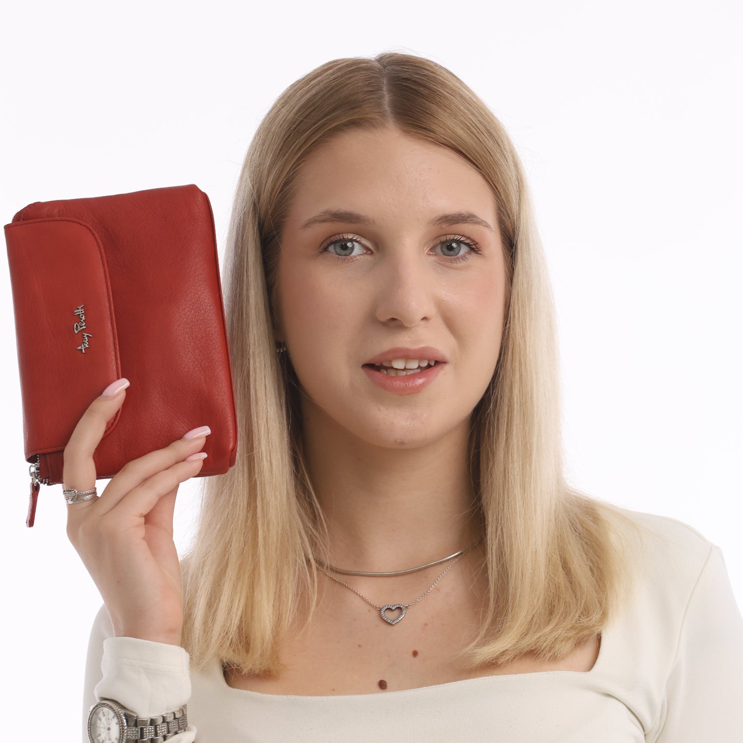 Woman holding Tony Perotti Contatto 2027 rosso cosmetic bag