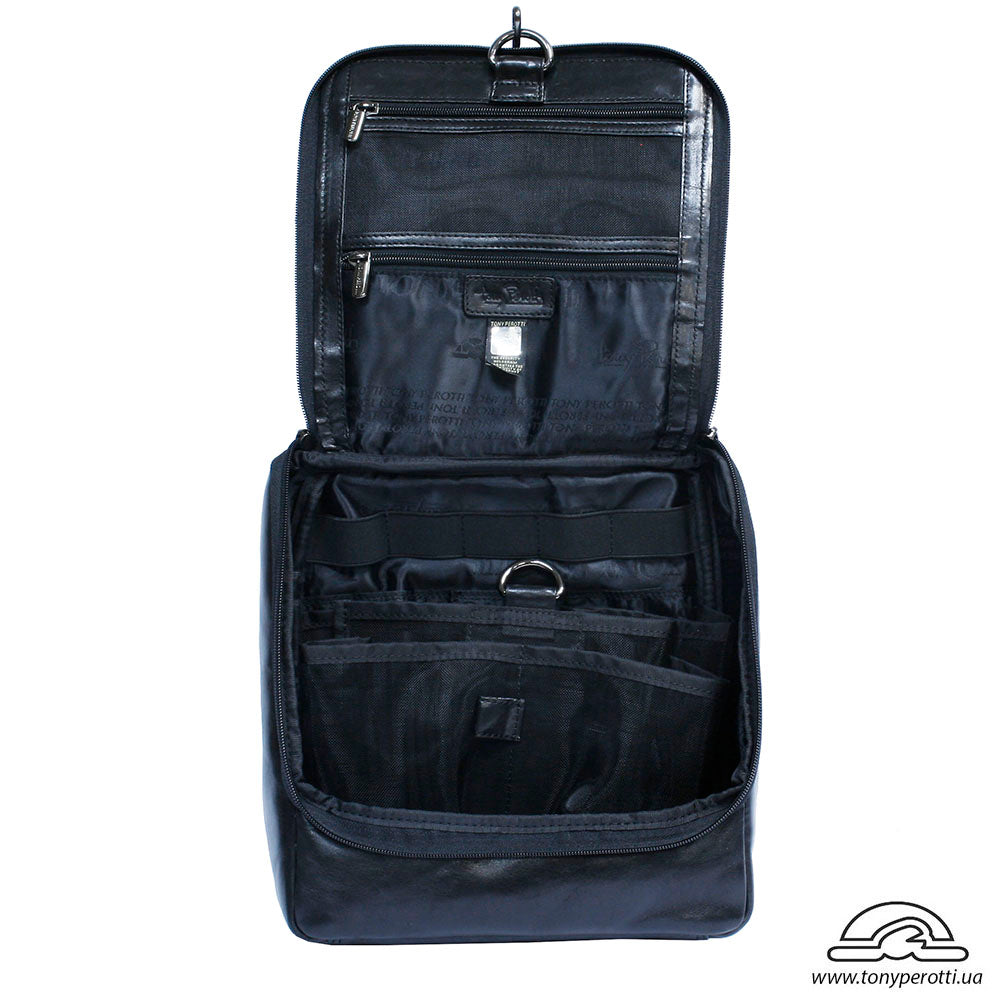 Open Tony Perotti Italico 8220 nero toiletry bag showing zip pockets, elastic holders and fitted compartments