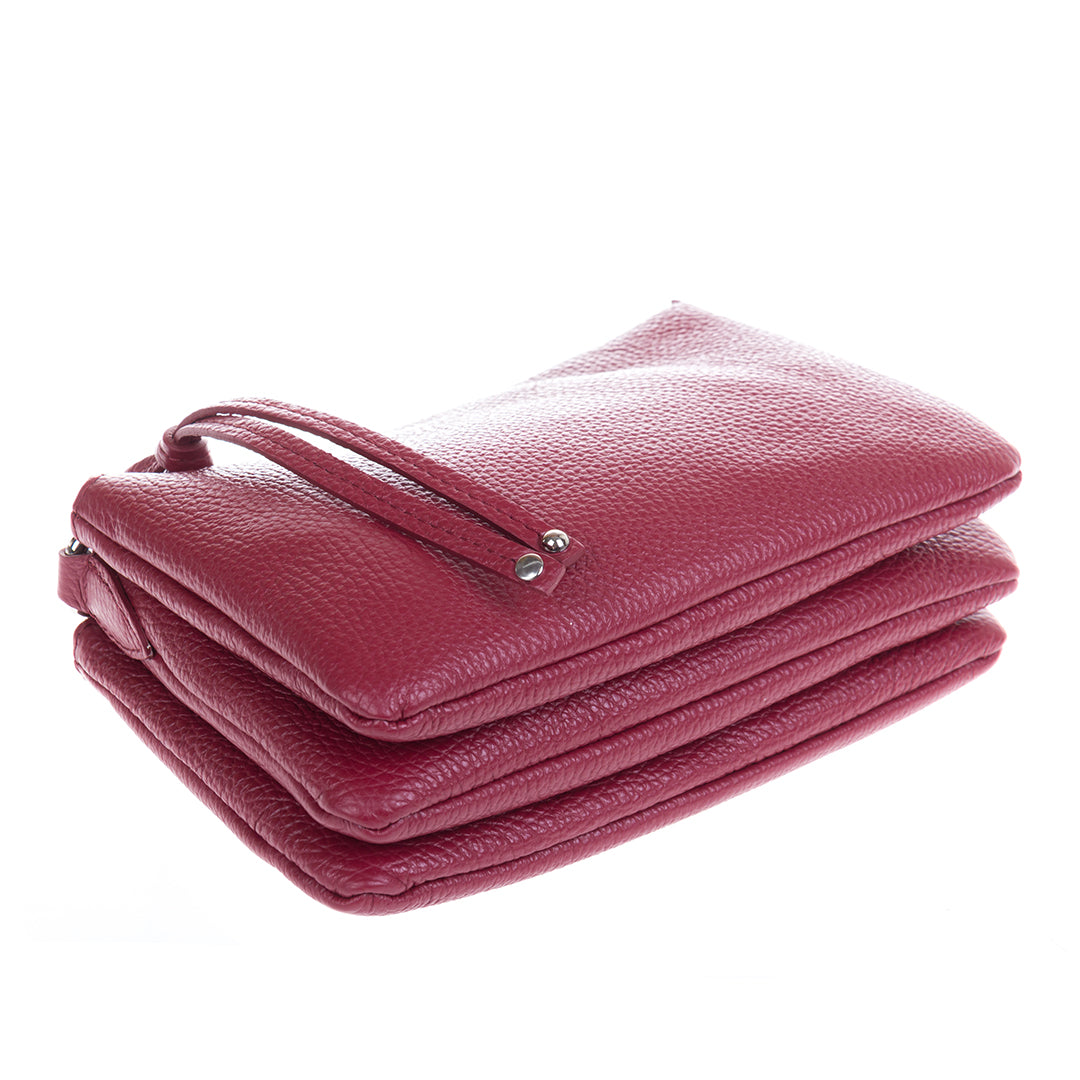 Tony Perotti Borsa CA04B-30DR red leather bag laid flat, the three compartments stacked one behind the other