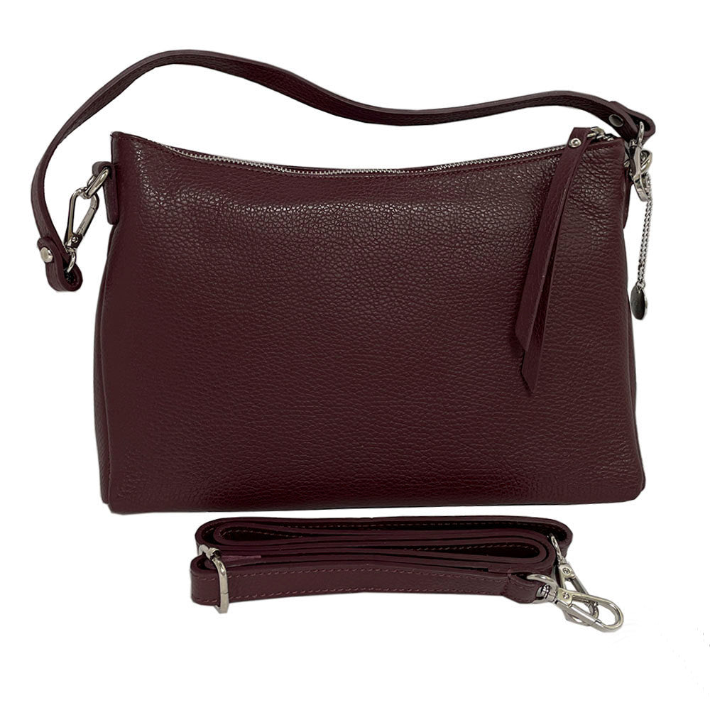 Tony Perotti Borsa CA01A-18BO burgundy leather bag with both straps — the short shoulder strap on the bag and the long detachable strap laid out below it
