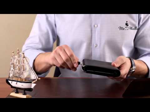 Video review of the Tony Perotti New Contatto 2598 nero — the long black leather zip-around wallet turned in the hands at a desk, showing the zip running round the edge