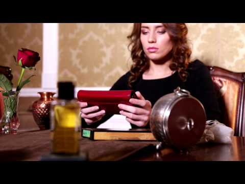 Video review of the Tony Perotti Accademia 1526 leather wallet with kiss-lock coin purse — shown in red, opened at a table to show the inside
