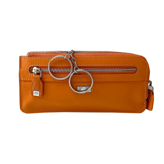 Tony Perotti Contatto 2376 arancio — orange leather key pouch with the two rings on chains pulled out and the silver turtle plaque on the front