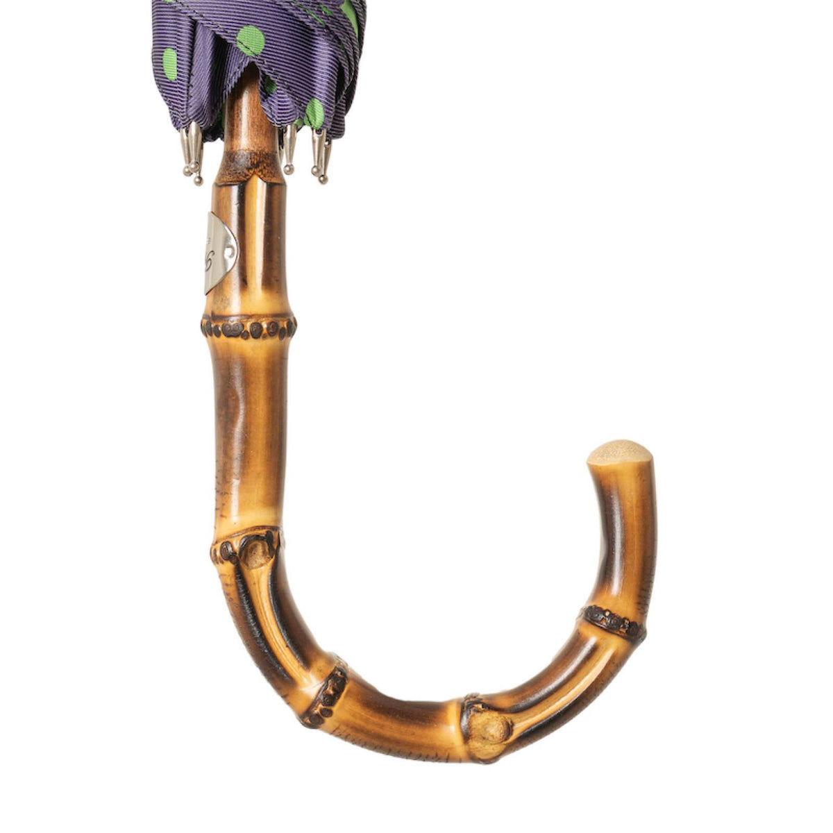 Bamboo crook handle with silver-tone Pasotti plaque below the furled canopy, handcrafted in Italy
