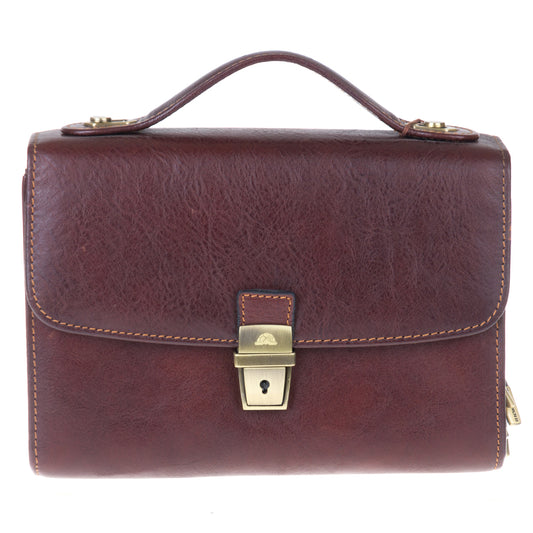 Tony Perotti Italico 9337 men's dark brown leather clutch — front view with flap, antique brass clasp lock and wrist strap on top
