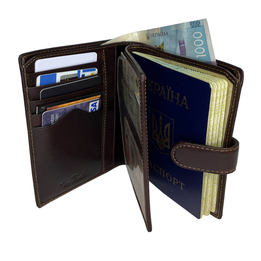 Tony Perotti Italico 2242 moro passport wallet opened with a passport held under the tab, card slots and a hinged inner leaf with a clear sleeve