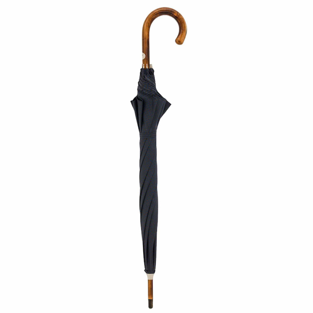 Closed navy umbrella standing upright with maple crook handle
