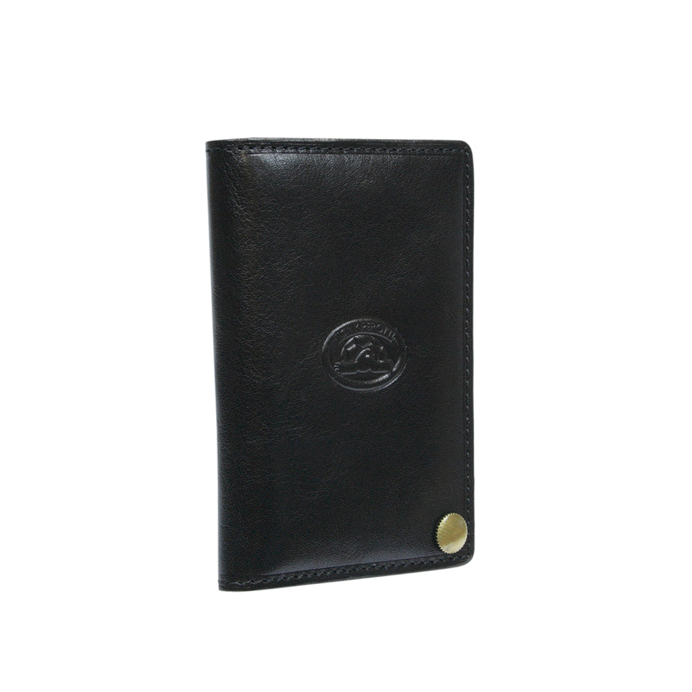 Black leather business card holder closed, angled view with brass stud — Tony Perotti Italico 2028 nero