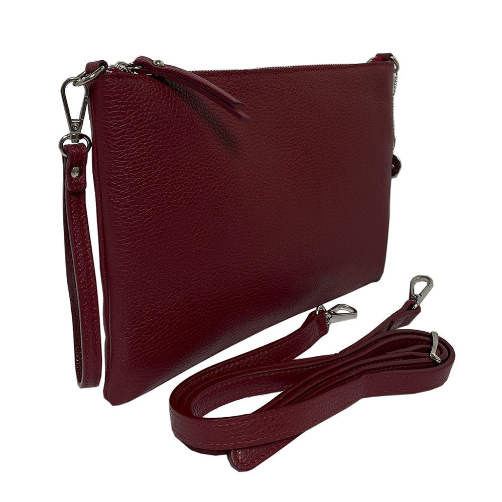 The red Borsa CA046 at an angle with the long leather shoulder strap detached and laid out beside it