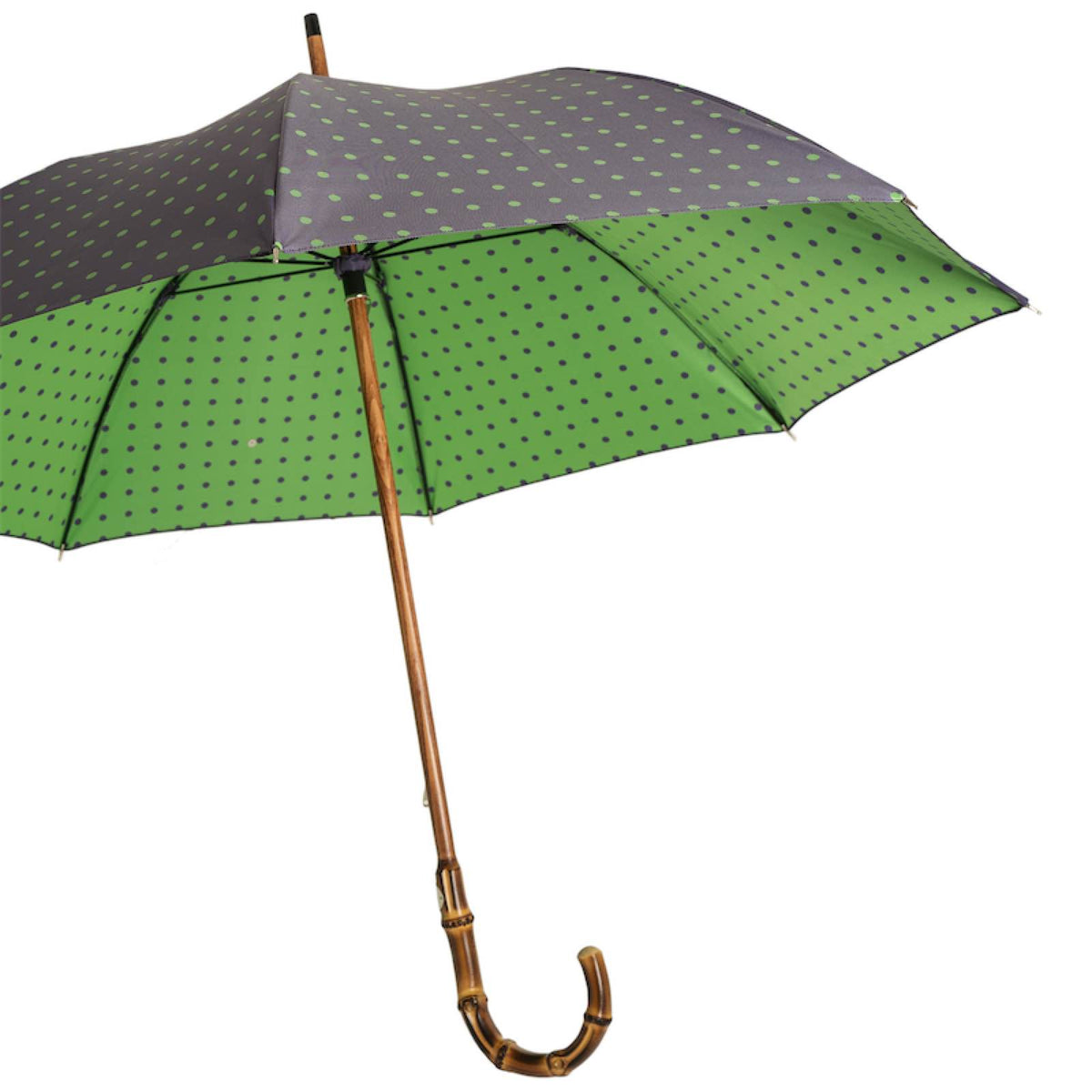 Open umbrella from the side: purple with green dots outside, green with purple dots underneath