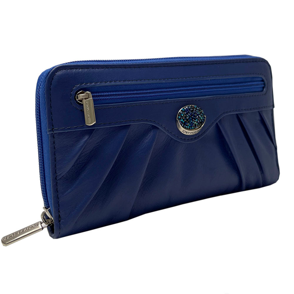 Blue Swarovski 3160 zip-around wallet at an angle showing the crystal medallion